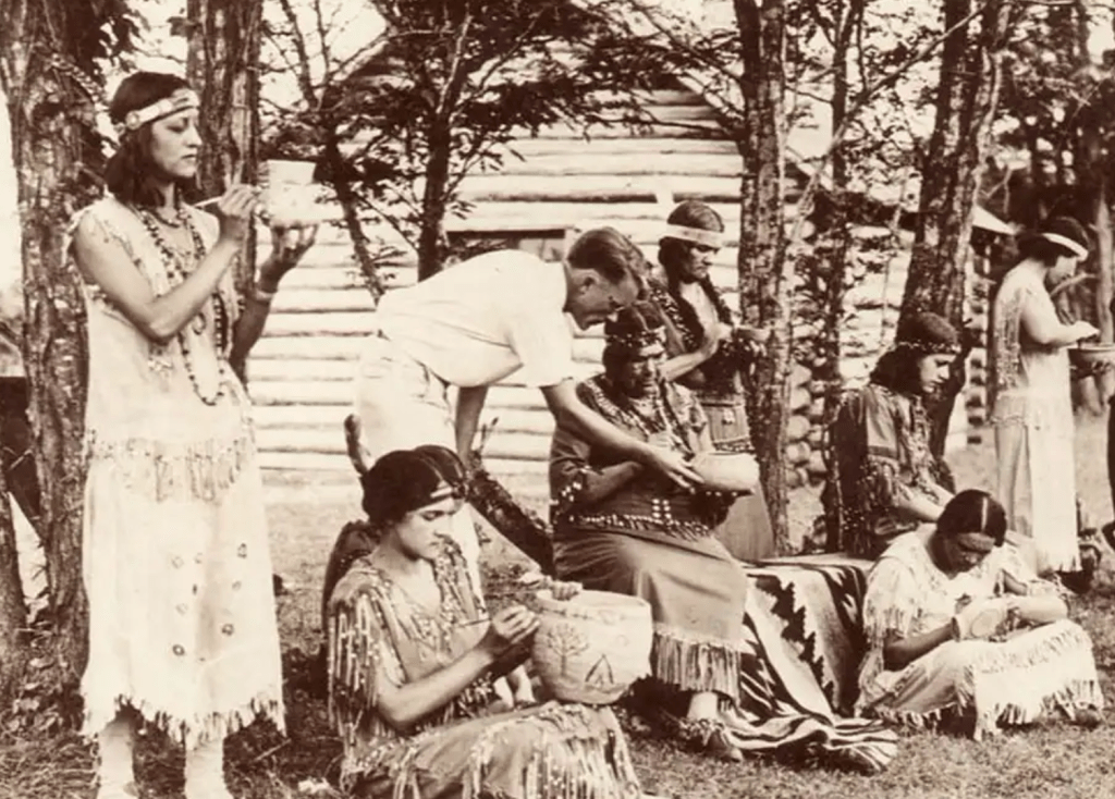 Pamunkey women making pottery at the Pottery School on the Reservation in the early twentieth century.